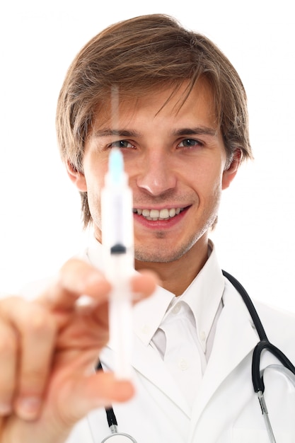 portrait of young doctor man with syringe