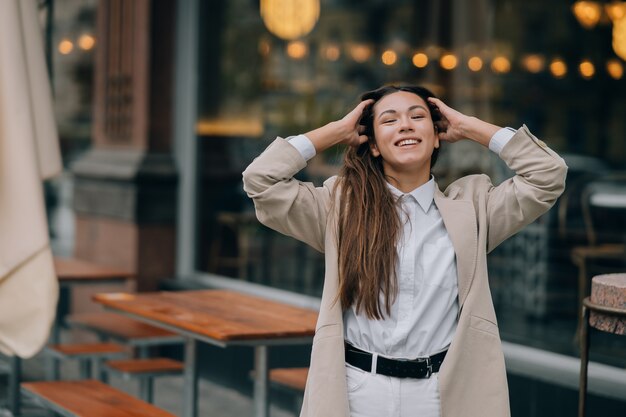 Portrait of a young fashionable woman on the street