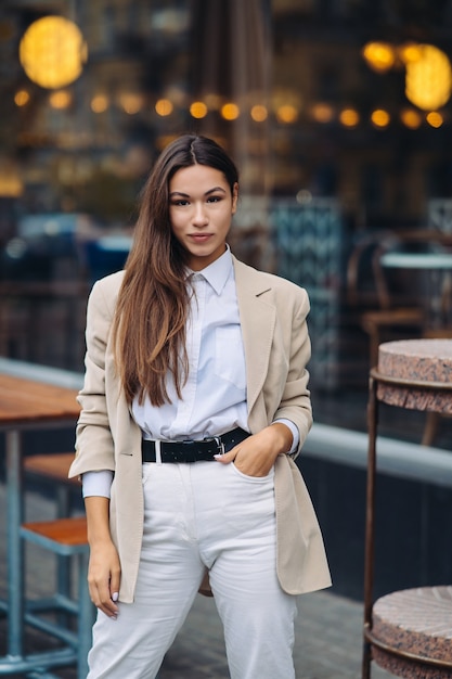 Portrait of a young fashionable woman on the street