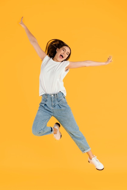 Free photo portrait young female jumping