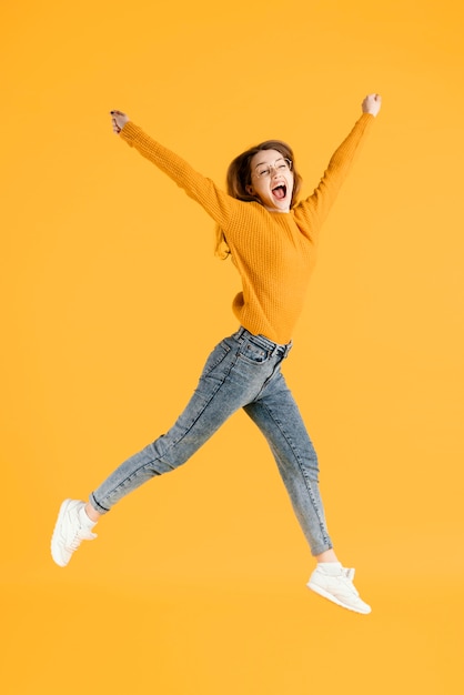 Portrait young female jumping