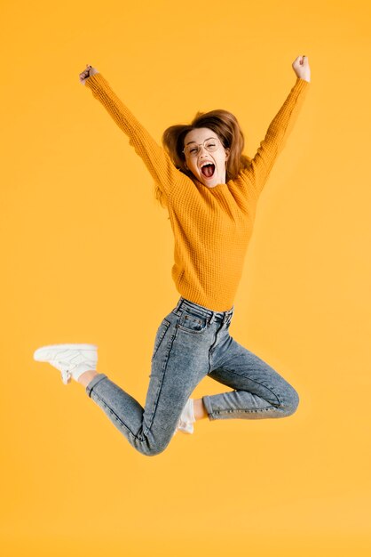 Portrait young female jumping