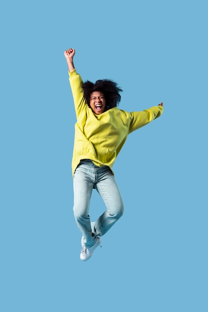 Portrait young female jumping