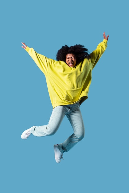 Portrait young female jumping