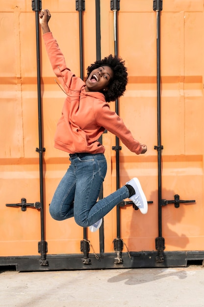 Free photo portrait young female jumping