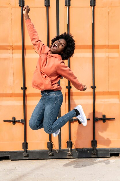 Portrait young female jumping