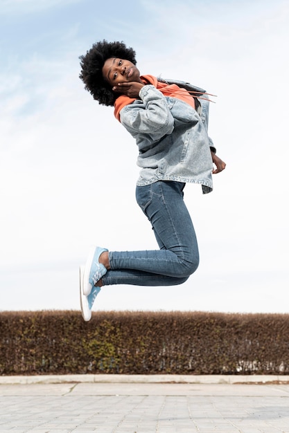 Portrait young female jumping