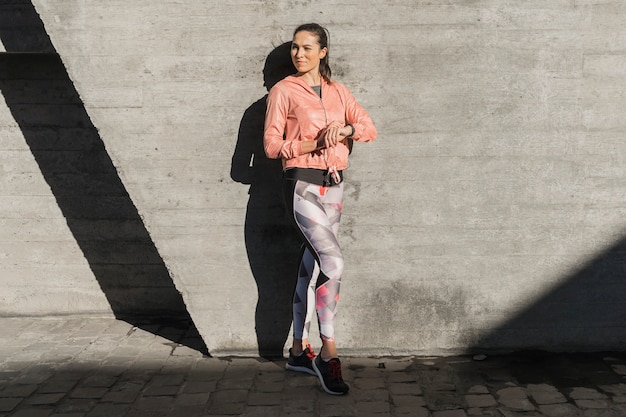 Free photo portrait of young female in leggings