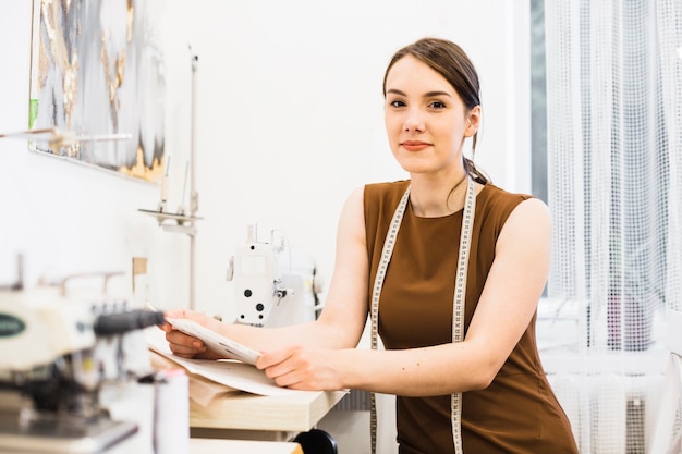 Portrait of a young female seamstress