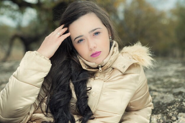 Portrait of a young female thoughtfully looking to the camera