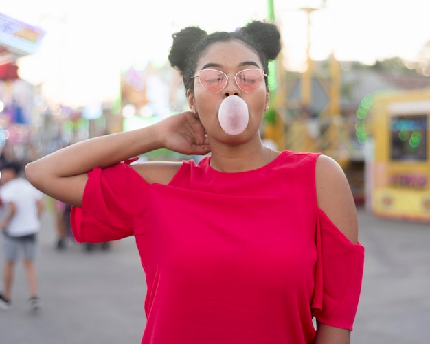 Portrait of young girl chewing bubble gum