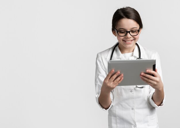 Portrait of young girl dressed up as doctor