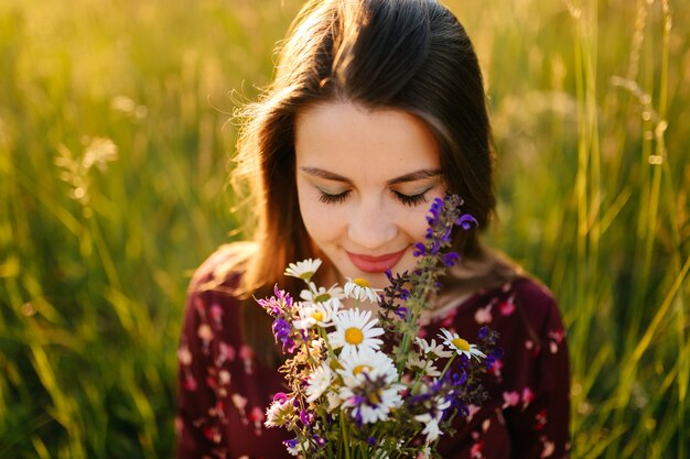 portrait of young girl on grass and trees park landscape