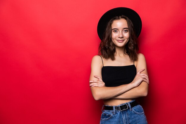 Portrait of young girl isolated over red wall