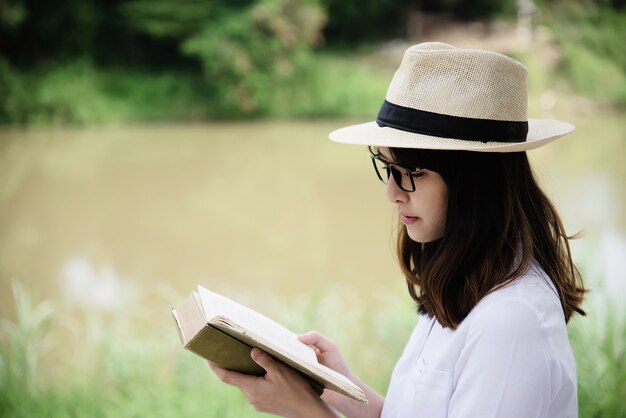 Portrait young girl reading a book