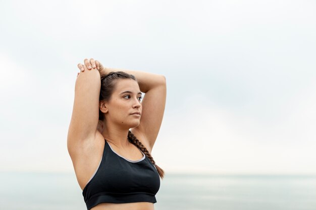 Portrait of young girl in sportswear exercising