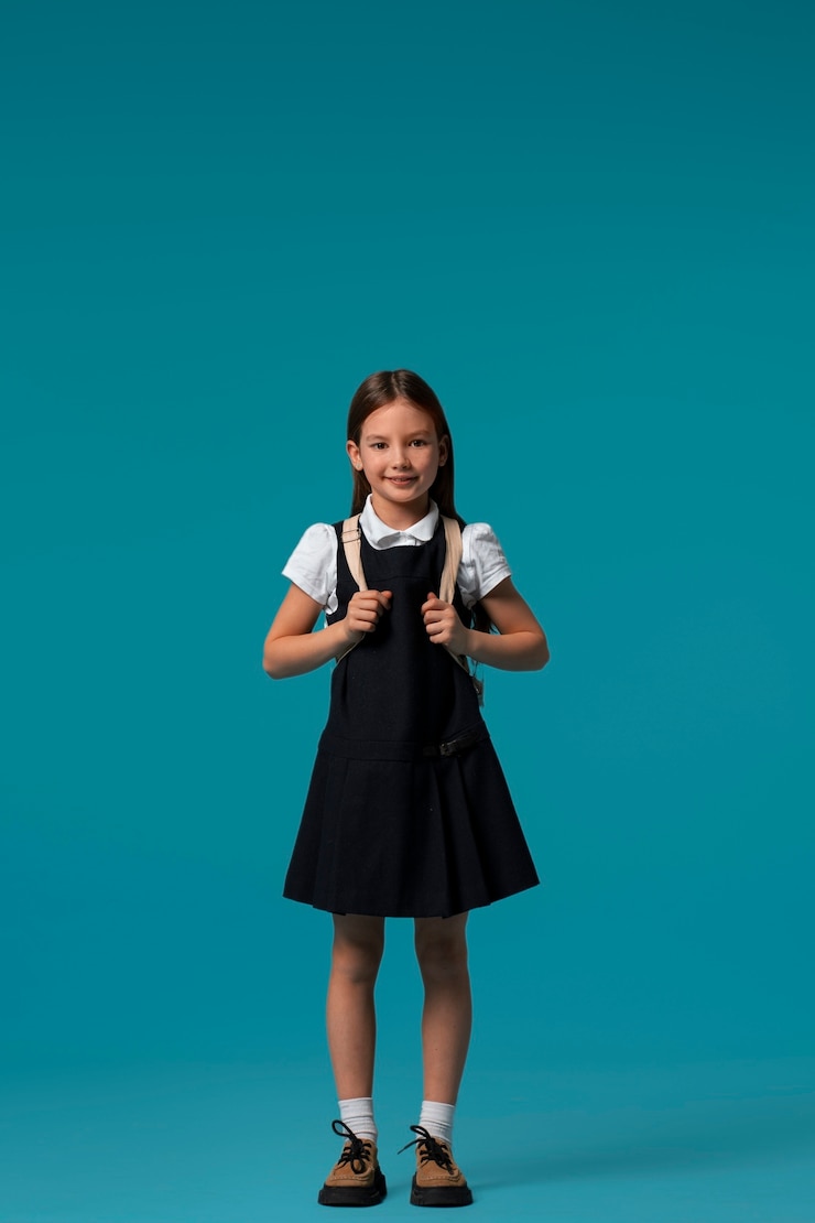 Free Photo portrait of young girl student in school uniform
