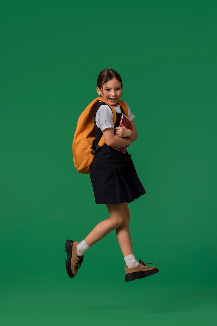 Free Photo portrait of young girl student in school uniform