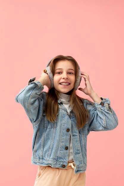 Portrait of young girl with ear muffs