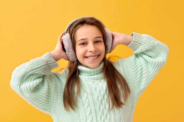 Portrait of young girl with ear muffs