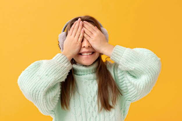 Portrait of young girl with ear muffs