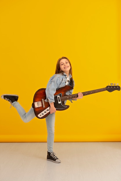 Portrait of young girl with guitar