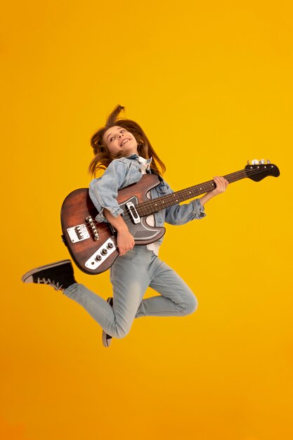 Portrait of young girl with guitar