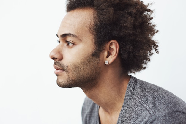 Portrait of young handsome african man in profile.