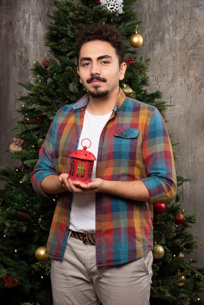 Portrait of young handsome guy during chrsitmas.