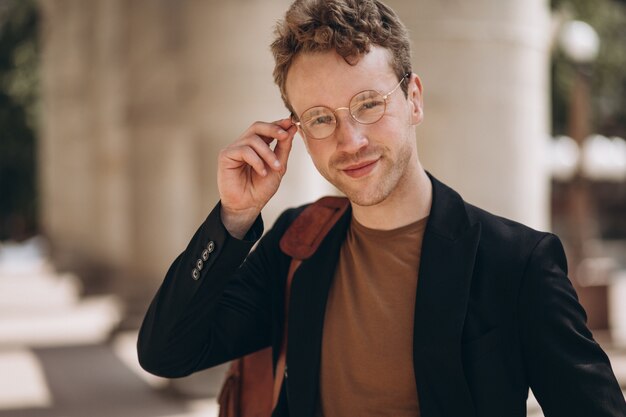 Portrait of young handsome man in spectacles