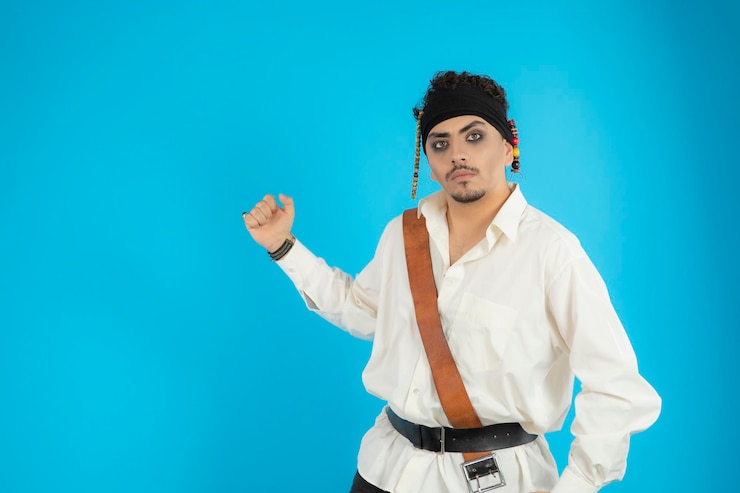 Free Photo portrait of a young handsome pirate squeezed his fists and looking at the camera. high quality photo