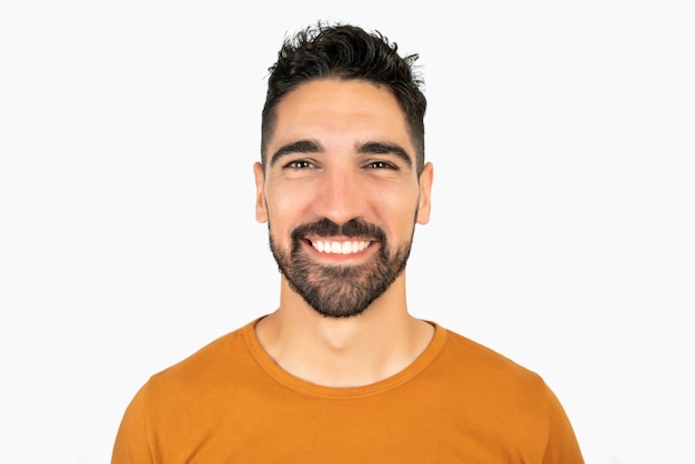 Free photo portrait of young happy man smiling against white space