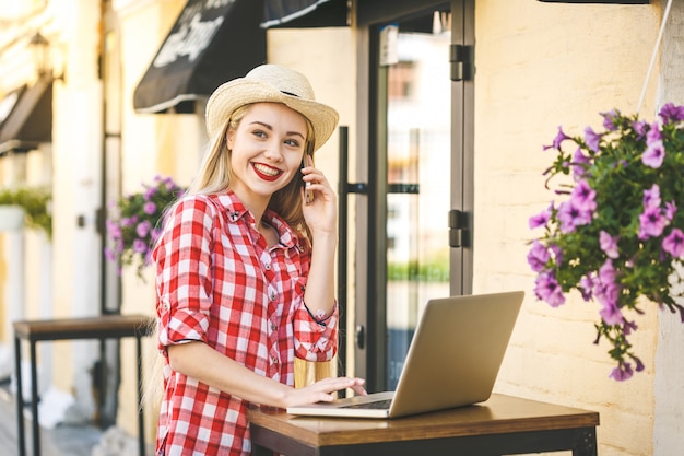 Portrait of young happy smiling woman. online shopping. with laptop.