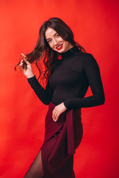 Portrait of young happy woman in studio