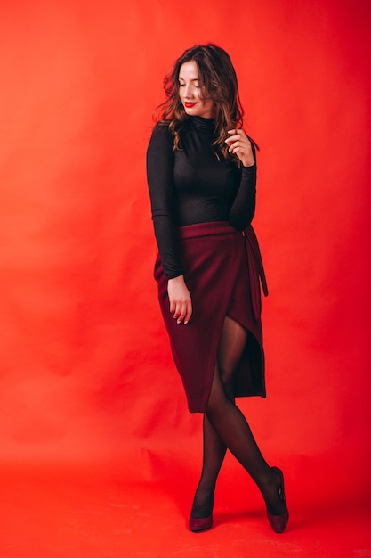 Portrait of young happy woman in studio