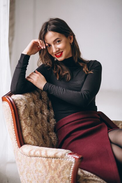 Portrait of young happy woman in studio