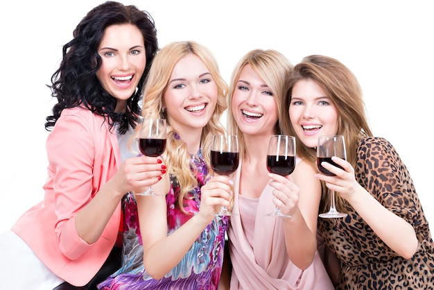 Free photo portrait of young happy women having fun and drinking red wine - isolated on white