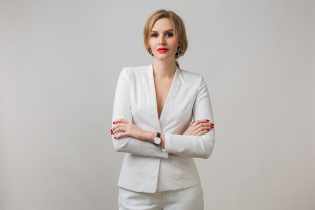 Portrait of young lady in white suit confident