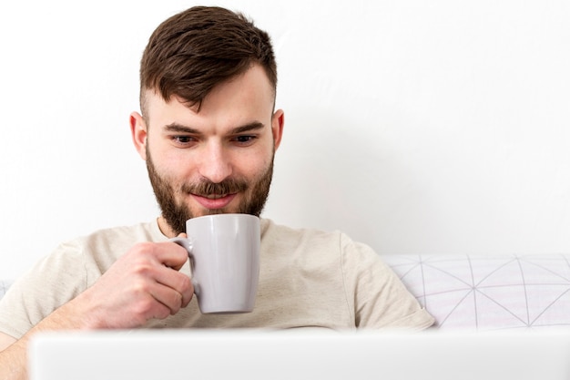 Portrait of young male enjoying work from home