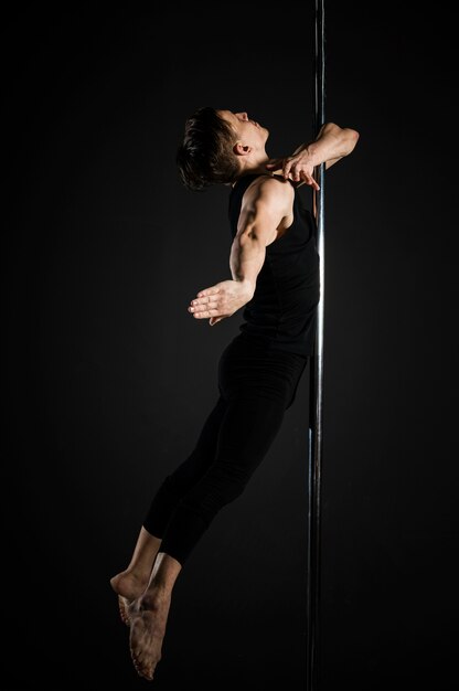 Portrait of young male pole dancer