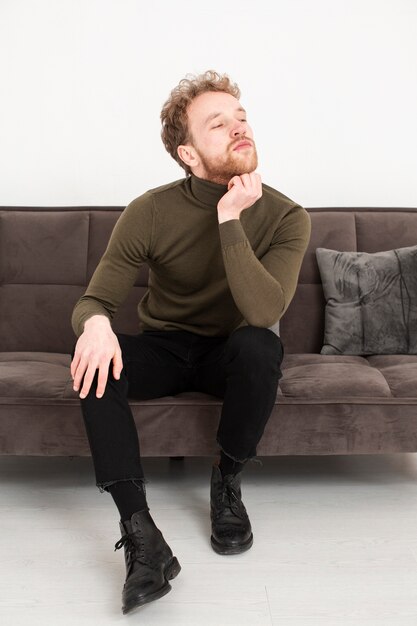 Portrait young man on couch