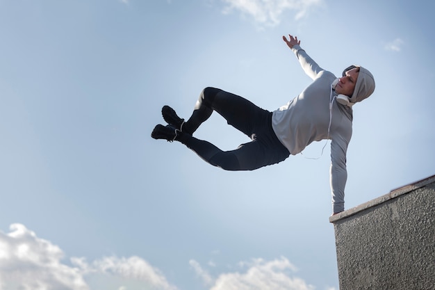 Portrait of young man doing parkour