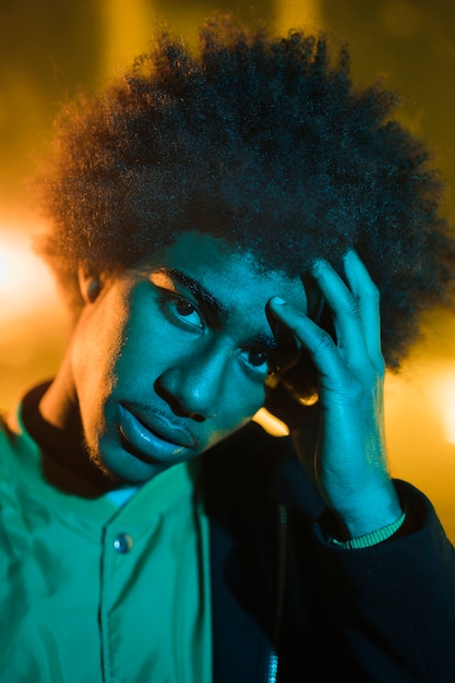 Portrait of young man going out at night