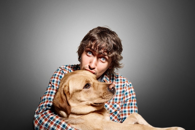 Portrait of young man and his cute dog