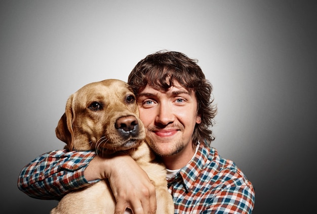 Portrait of young man and his cute dog