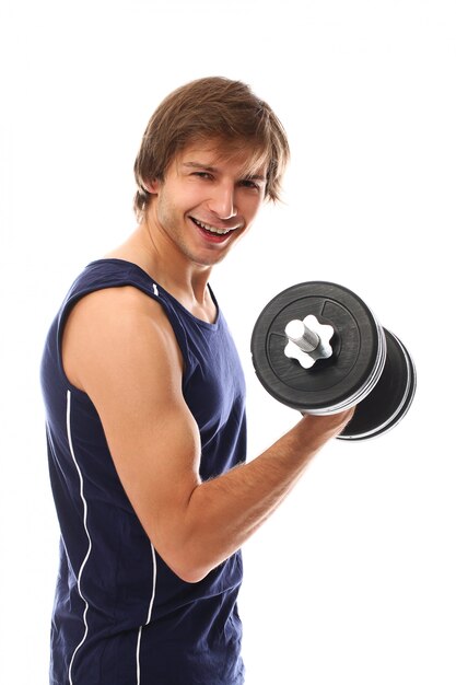 portrait young man holding a dumbbell