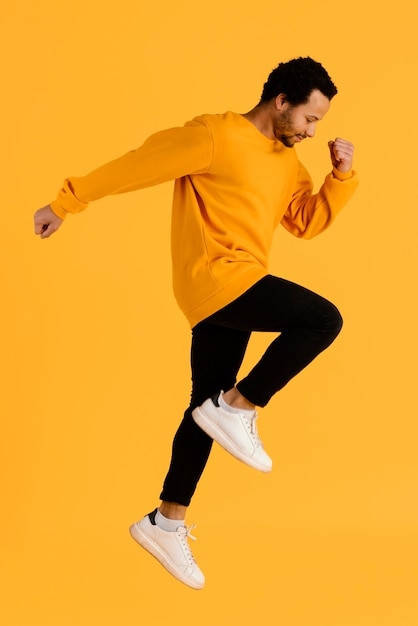 Portrait young man jumping