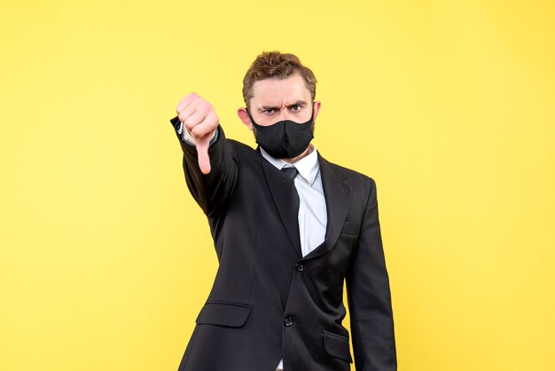 Portrait of young man making negative gesture