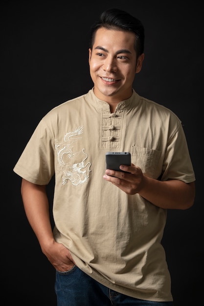 Portrait of young man wearing embroidered shirt