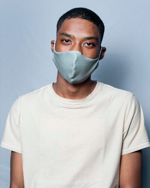 Portrait young man wearing mask